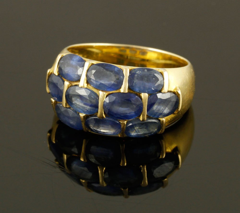 18K Gold and Sapphire Ring: 18K yellow gold and sapphire ring, approximately 7 g. TW, size 8 1/4. Provenance: From a Massachusetts estate.
