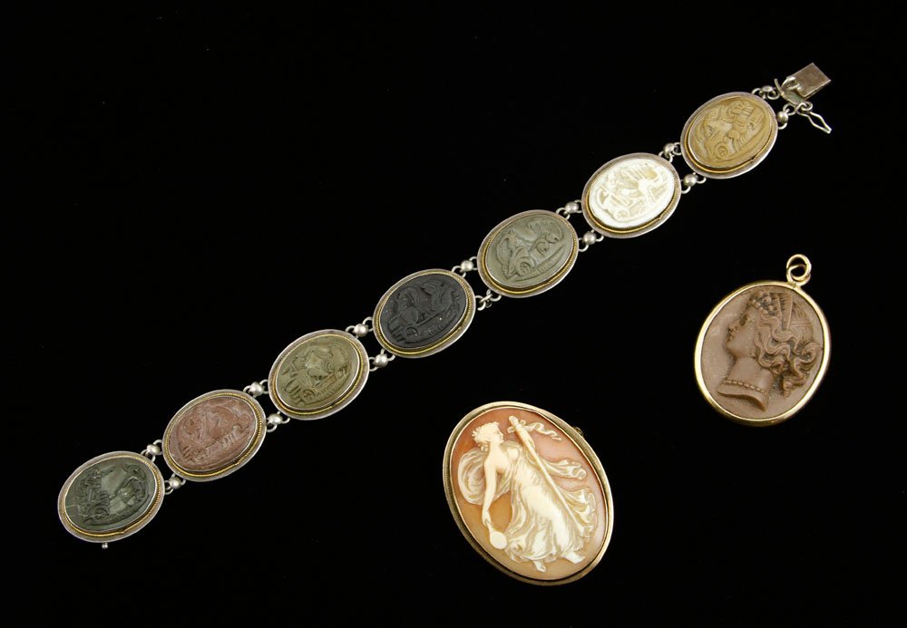 3 Piece Cameo Lot: Three piece cameo lot, to include: 14K yellow gold and shell cameo pendant, gold fill and lava cameo pendant, .800 silver lava cameo bracelet with classical scenes, 7 1/4" l (bracelet). Provenance: Fr
