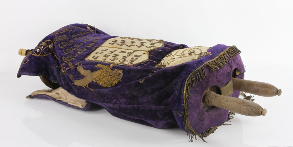 Torah with Hand Embroidered Cover: Torah, with hand embroidered purple cover, c. 1890-1920, Central European, written in Ashkenazi script with good black ink on parchment, 37" l from stave to stave. Provenance: From a Massachusetts est