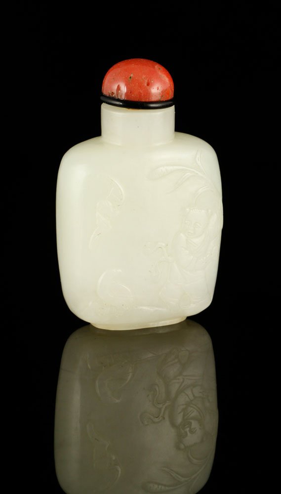 Chinese White Jade Snuff Bottle: White jade snuff bottle, China, Qing Dynasty, red top, carved with a child, a bird and a bat on one side and a crane standing under bamboos on the other side, 2 3/8" x 1 5/8".