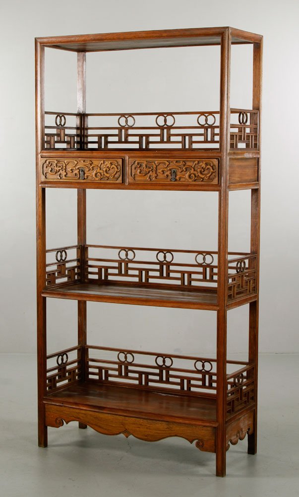 Chinese Huanghuali Cabinet: Huanghuali cabinet, China, three tiers, carved with two-ring motifs, geometric patterns and others, 70 1/2" h x 35" l x 15" w.