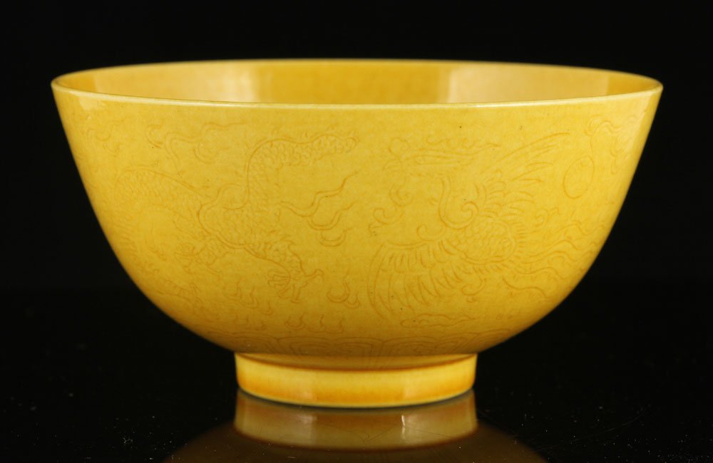 Chinese Yellow Glazed Carved Phoenix and Dragon Bowl: Yellow glazed carved phoenix and dragon bowl, China, Qing Dynasty, Xian Feng mark, 2 1/4" x 4 7/8".
