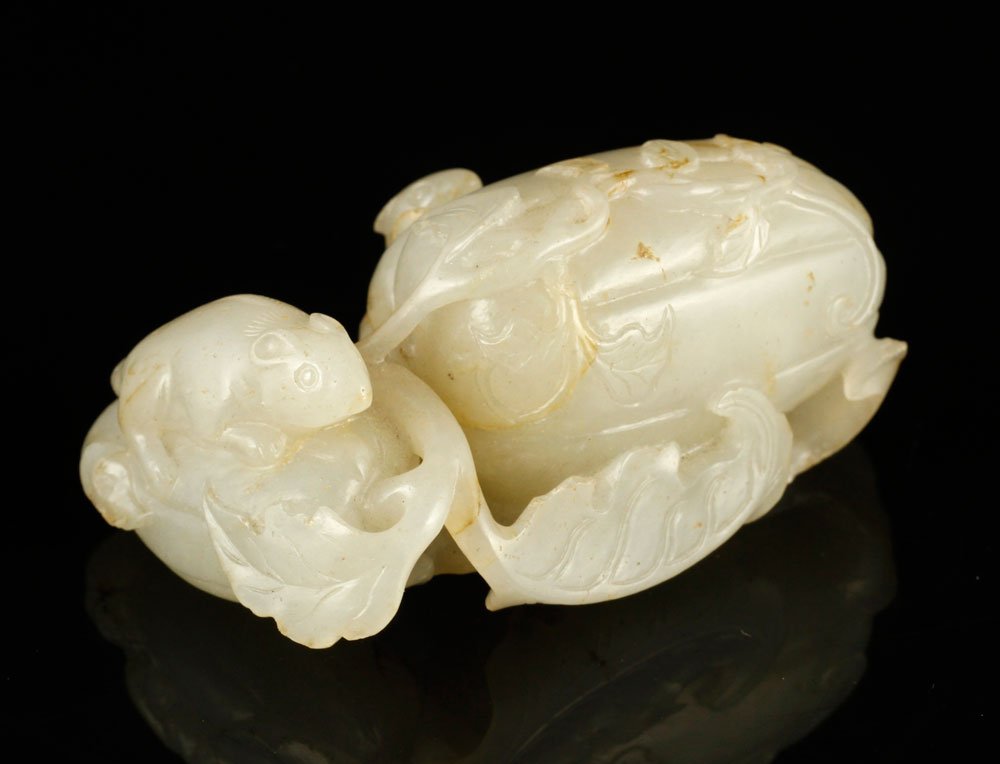 Chinese Snuff Bottle: Snuff bottle, China, carved jade, with squirrel carving.