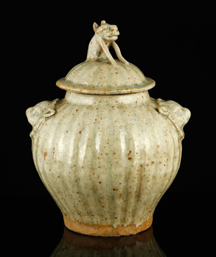 19th/20th C. Korean Jar: Jar, Korea, late 19th or early 20th century, earthenware, with celadon glaze, lion head handles and foo dog finial, 8" h x 6 1/2" dia.