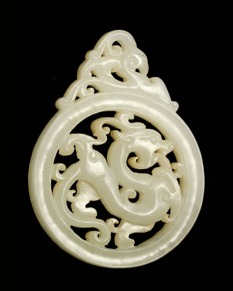 Chinese Jade Bi: Bi, China, jade, Han Dynasty style, 2 1/8" h x 1 1/2" w. Provenance: From a Massachusetts collection.