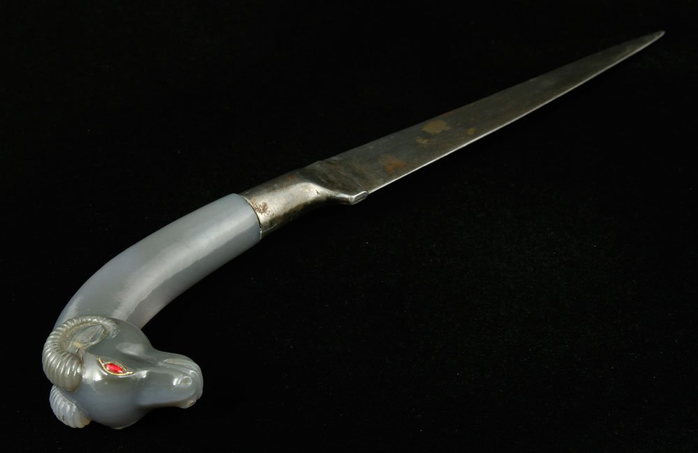 Mughal Dagger: Mughal dagger with hilt carved in the form of a ram, jade or agate, 12 1/4"l (overall), 6 1/2" (blade). Provenance: TX estate.