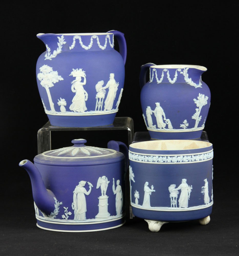 4 Pc. Wedgwood Jasperware: Four pieces of blue and white Wedgwood Jasperware, including vessel, teapot, two pitchers, 6"h (tallest). Provenance: FL estate.