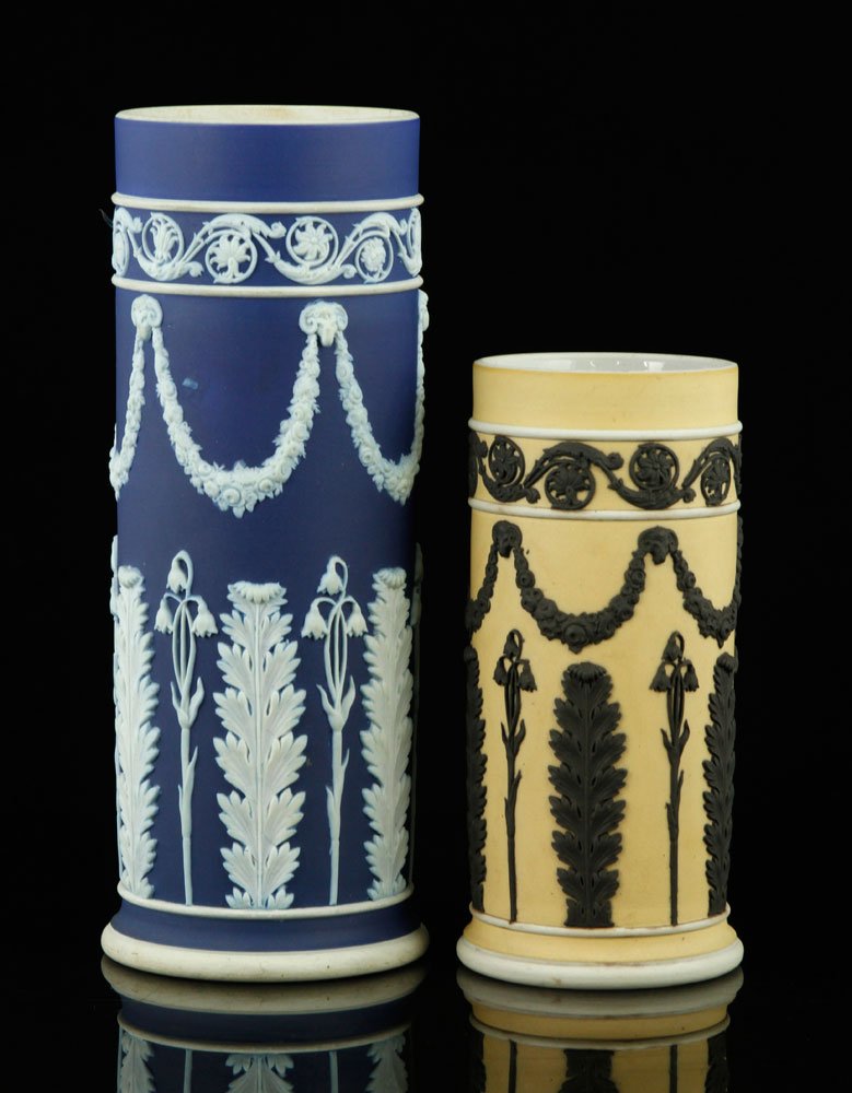 2 Wedgwood Jasperware Vases: Lot of two Wedgwood Jasperware vases, one blue and white, 7 3/4" x 2 3/4", one yellow and black, 5 1/2" x 2 1/2". Provenance: FL estate.