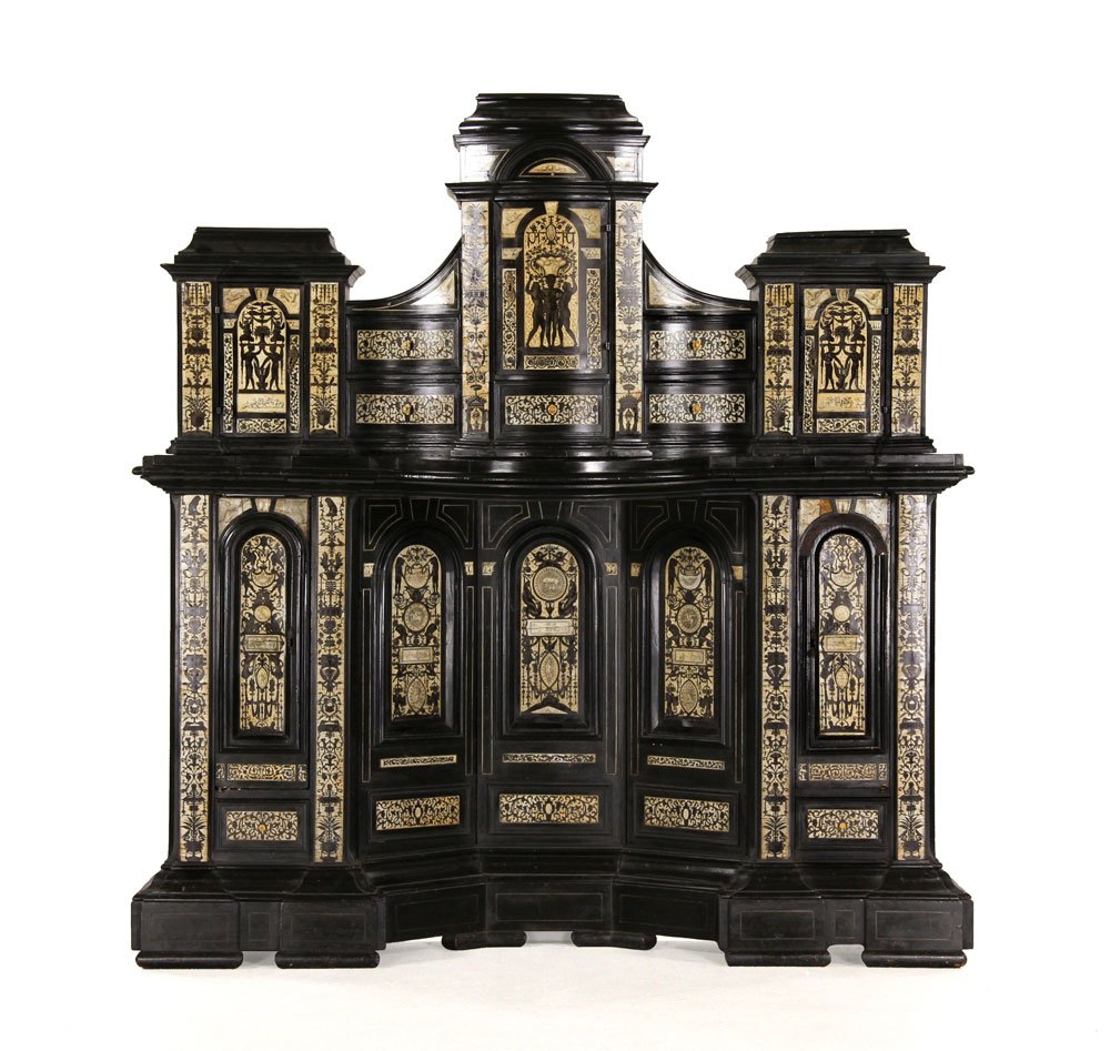 18th/19th C. Italian Ebonized Cabinet: Late 18th/early 19th century Renaissance Revival cabinet, ebonized wood, decorated with grotesques and classical figures, 65 1/4" h x 62 3/4" w x 13" d. Provenance: From a Massachusetts estate.