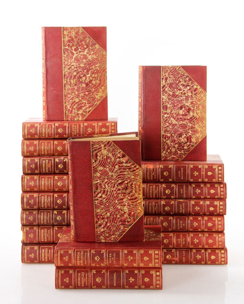 19 Historical Romances: Lot of nineteen historical romance volumes by William Harrison Ainsworth, red leather binding with marbleized boards. Provenance: From the Estate of Mary L. Alchian, Palm Springs, CA.