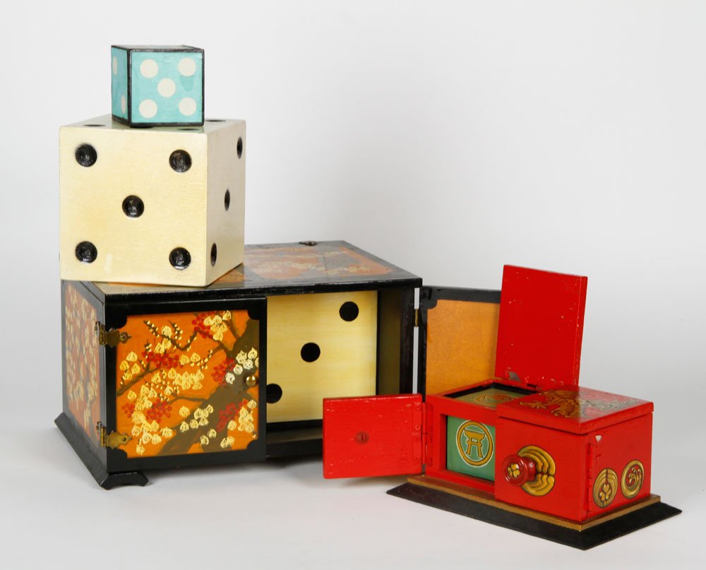 Two Hand Painted Die Boxes: Lot of two die boxes, both hand painted wood, one with cherry blossom branches on an orange background and one with gold phoenixes on red background, each with two die, 7"h x 11 1/4"w x 8 3/4"d (large
