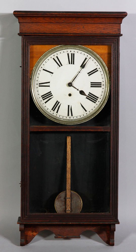 Early 20th C. Sessions Wall Clock: Early 20th century Sessions oak regular wall clock, with key and pendulum, 38 1/2"h x 16 1/2"w x 4 3/4"d. Operational condition unknown.
