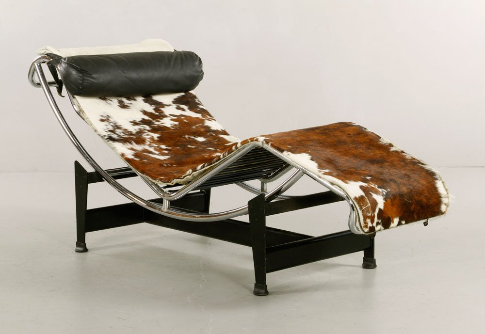 Le Corbusier Model LC4 Chaise Lounge: Le Corbusier model LC4 chaise lounge, steel with original cowhide upholstery and original leather pillow, 29"h x 66"w x 22"d. Provenance: From a MA estate.
