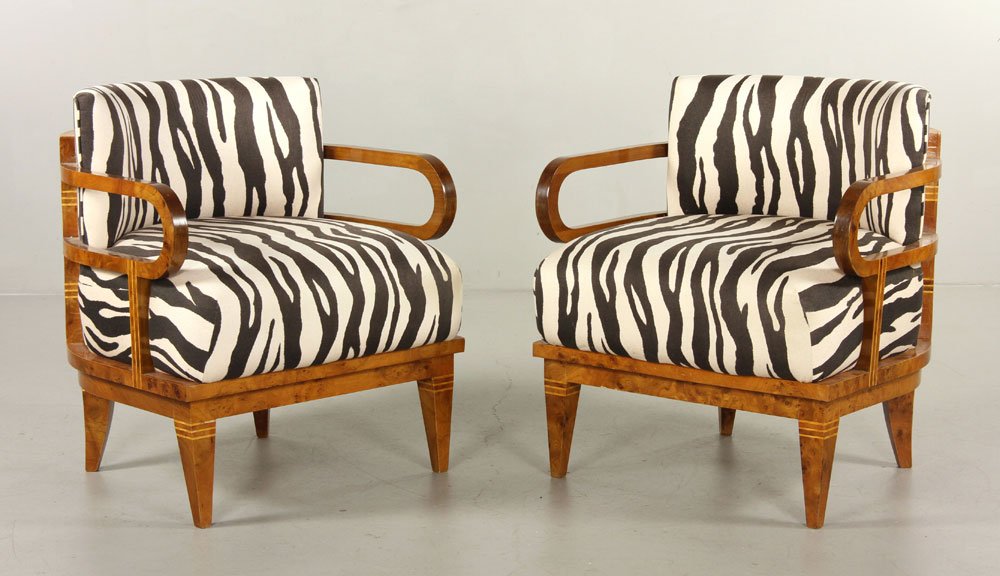 Ponti Burlwood Veneer Arm Chairs: Gio Ponti arm chairs, barrel back burlwood veneer with zebra print upholstery, 30"h x 27"w x 25"d. Provenance: From a MA estate.