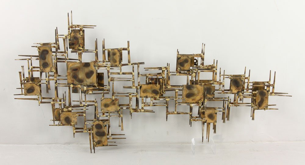Jeré Style Brutalist Wall Sculpture: In the style of C. Jeré, brutalist wall sculpture, cut-nail and brass sheet metal, with two mounting hooks verso, 47"h x 26"w x 4 1/2"d. Provenance: From a New Hampshire collection.