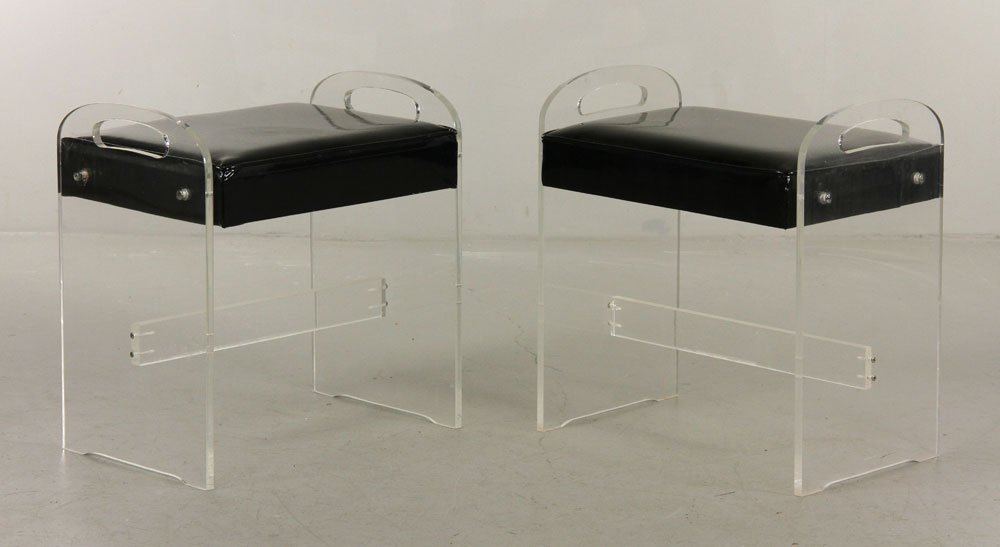 Pr. Mid C. Stools: Pair of mid 20th century stools, lucite with padded seats and cut-away handles, 19"h x 20"w x 12"d. Provenance: From a FL estate.