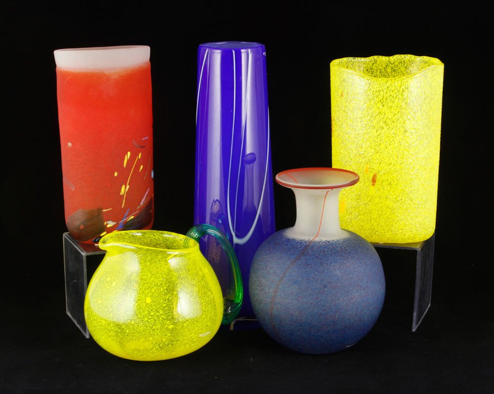 5 Kosta Boda Glass Pieces: Lot of five Kosta Boda glass pieces, including four vases and one pitcher, all marked and two with stickers, 13"h (tallest). Provenance: From a MA estate.