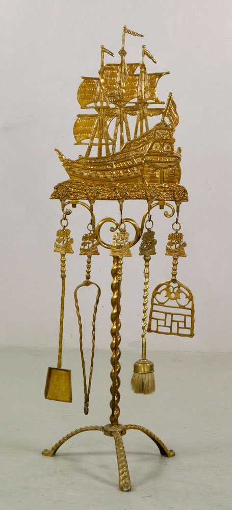 19th C. Dutch Brass Fireplace Tools: 19th century Dutch fireplace tools, brass, to include: tongs, brush, poker, shovel, and stand, with Spanish galleon "Don Fernando" design, largest 48" h x 15" w x 16" d. Provenance: From the estate of