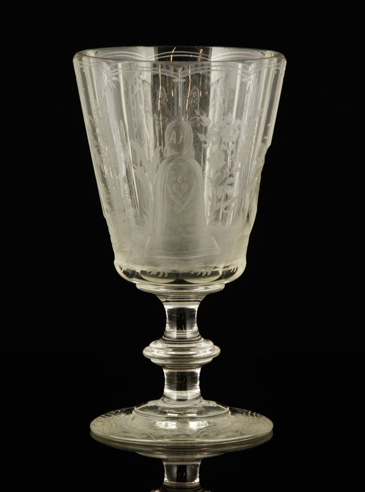 19th C. Intaglio Engraved Glass Goblet: Intaglio engraved blown glass goblet, c. 1860-1880, decorated with allegorical scene, 6 1/8" h x 3 1/2" dia. Provenance: From a Massachusetts estate.
