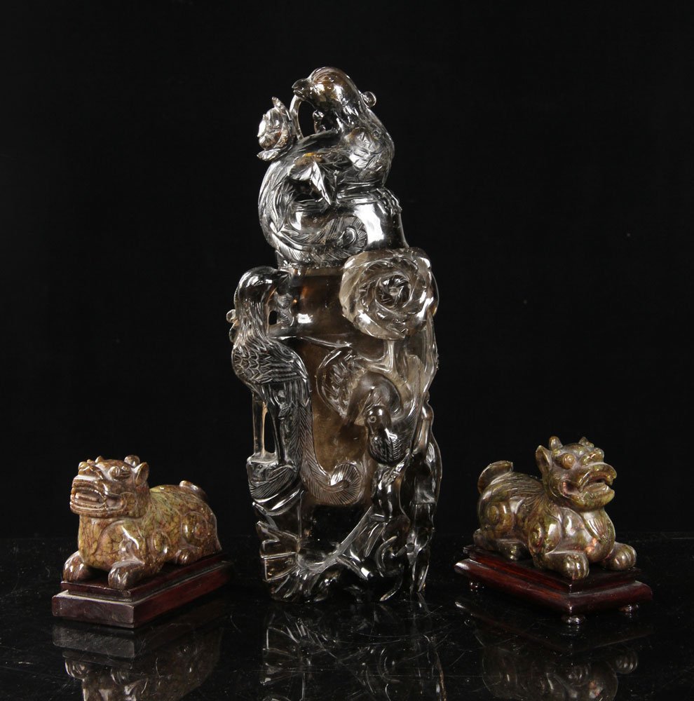 3 Chinese Carved Items: Lot of three Chinese carved items, to include: rock crystal vase with carvings of phoenixes and flowers, and two hard stone carved foo dogs, largest 13 1/2" h. Provenance: From a Massachusetts estate.