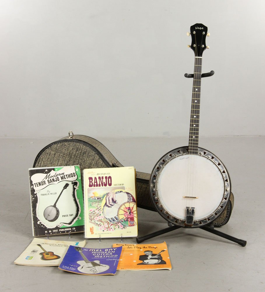 Vega Four String Banjo with Case and Books: Vega four-string banjo, with case and seven music books, neck inlaid with mother of pearl, 34" l overall, 22" neck. Provenance: From a Massachusetts estate.