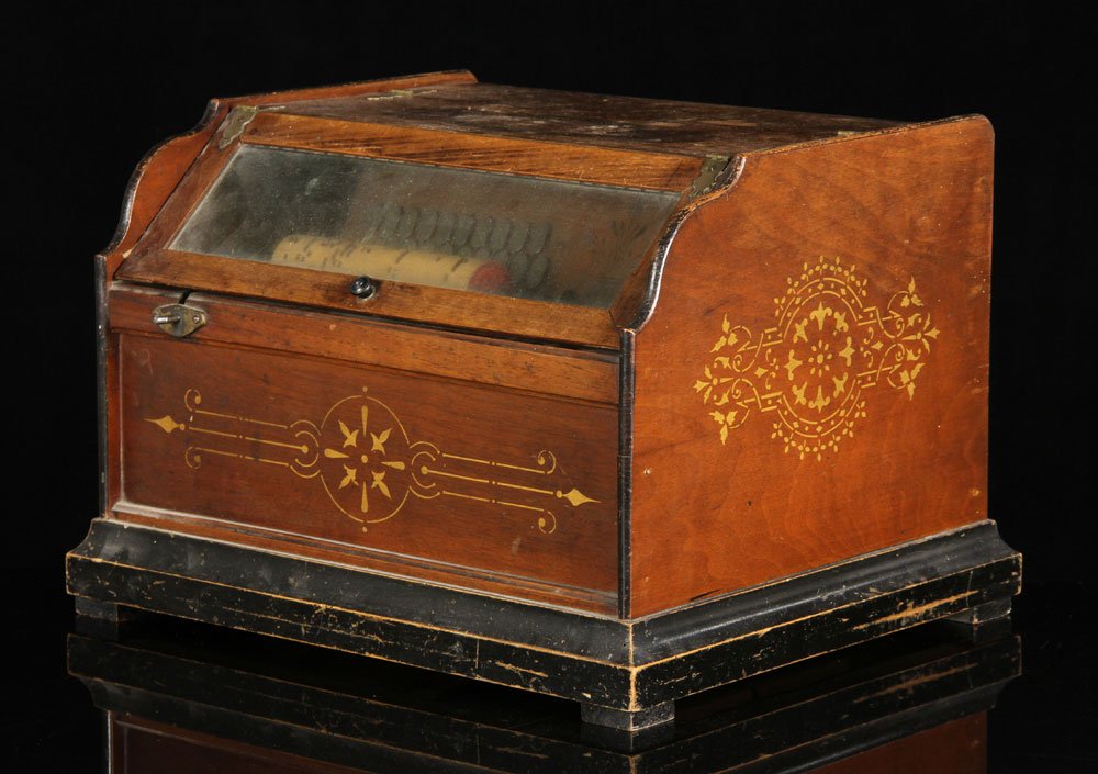 Music Box Roller Organ: Countertop music box roller organ, with 12 cylinders, 12" h x 17" w x 14 1/2" d. Provenance: From a Massachusetts estate.