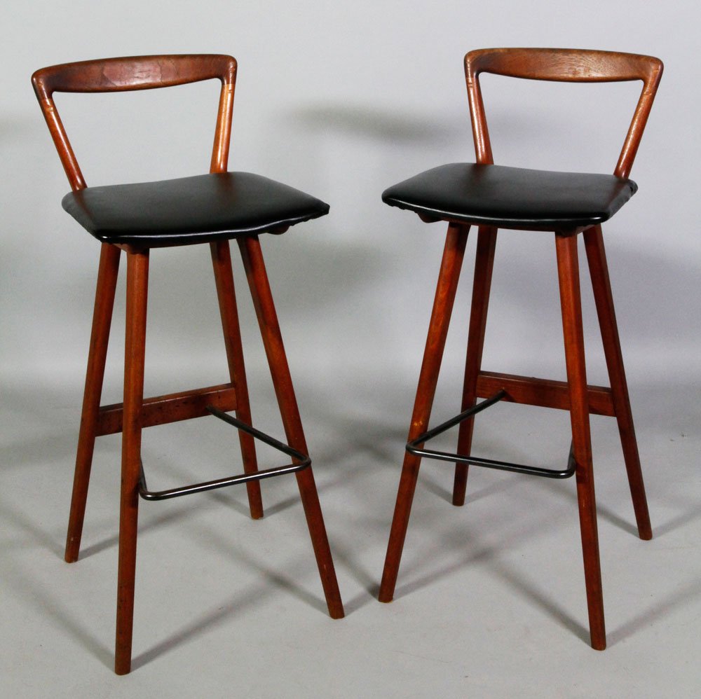 Pr. Danish Modern High Stools: Pair of Danish Modern high stools, Mobelfabri (SGCD), c. 1960, branded marks, 35 1/2" h x 14" w x 14 1/2" d. Some splits to leather cushions, light wear and scratching to finish.