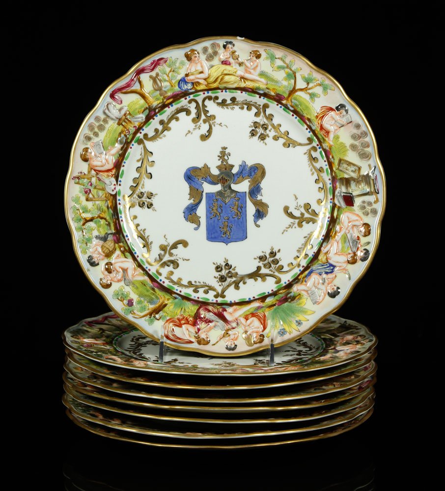 Italian Capodimonte Hand Painted Porcelain Plates: Italian Capodimonte plates with armorial crest, hand painted porcelain, marked on bottom, 11" dia. Provenance: From the unreserved estate of a prominent Los Angeles attorney.