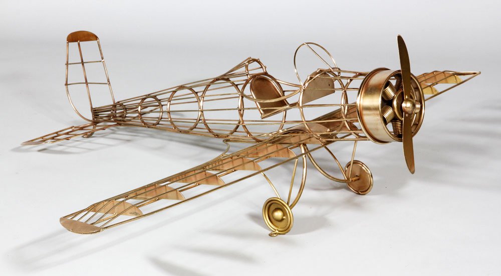 Jere Airplane Sculpture: Curtis Jere, airplane sculpture, enameled steel, signed back right wing, dated 1987 in ink, 14"h x 40" x 48". Provenance: Lynn, MA estate.