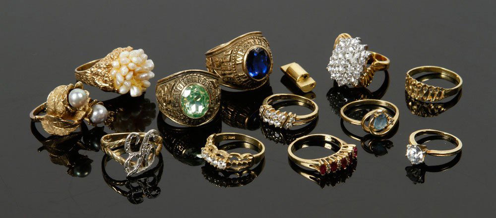 12 Gold Rings: Miscellaneous collection of twelve gold rings, including 10 14K, two 10K; two with diamonds; one with diamonds and rubies; three with faux diamonds; approximately 48 grams TW of 14K, and 28 grams TW o