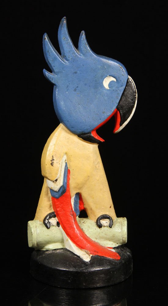 Cast Iron Parrot Door Stop: Door stop, parrot cockatoo, cast iron, Taylor Cook, circa 1930, part of original paper label verso, 11" x 4 1/2". Provenance: From a MA estate.