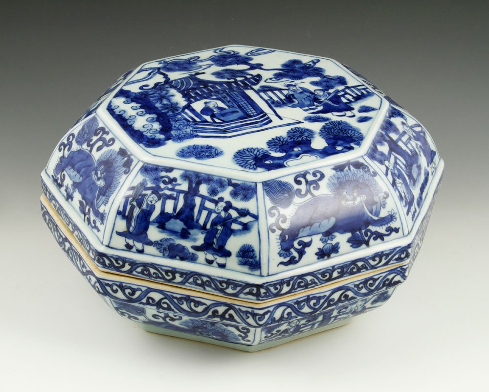 18th/19th C. Chinese Blue and White Box: 18th/19th century blue and white porcelain box, China, octagonal shape, decorated with foo lions and scenes of figures doing outdoor activities, with six character mark on base, 6"h x 12"dia. Provenan