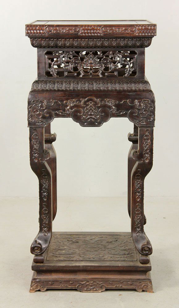 Chinese Carved Stand, Zitan: Chinese carved stand, zitan wood, depicting lotus flowers and other designs, 48" h x 22" w x 22" d.