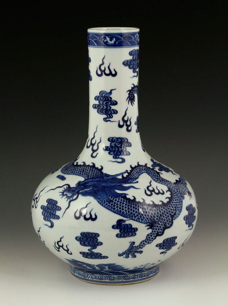 Chinese Blue and White Bottle Vase, Porcelain: Chinese blue and white bottle vase, porcelain, with Yongzheng mark, depicting a large dragon amongst clouds, 13 1/2" h x 9 1/2" dia.