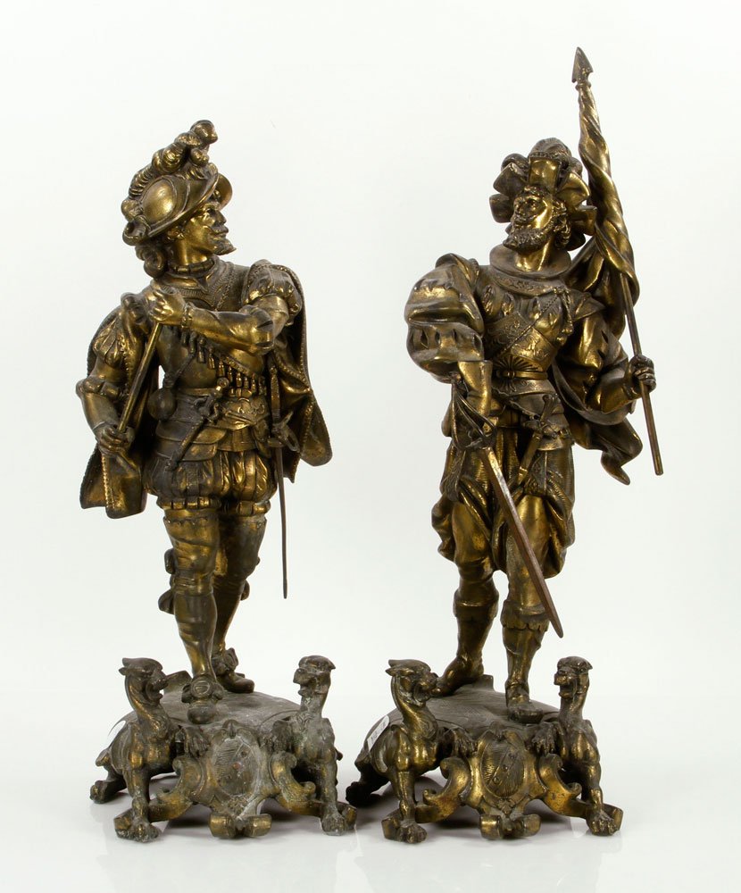 Baroque Style Cavalier Staues, Spelter: Pair Of Continental Baroque Style patinated spelter statues of Renaissance Cavaliers, each wearing partial armor, one with a battleaxe, the other with pinion, the plinths detailed with chimeras, 20 1/