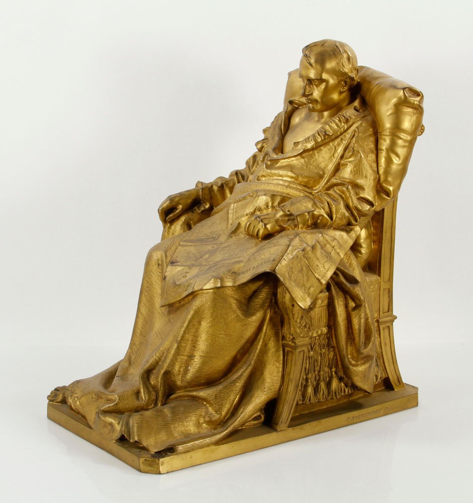 French Statue of Napoleon, Bronze: French cast bronze sculpture of Napoleon, cast by F. Barbedienne posed seated in his nightgown, a world map on his map, applied with a chocolate brown acid patina, 17" h x 13" w x 15 1/2" d. Provenanc