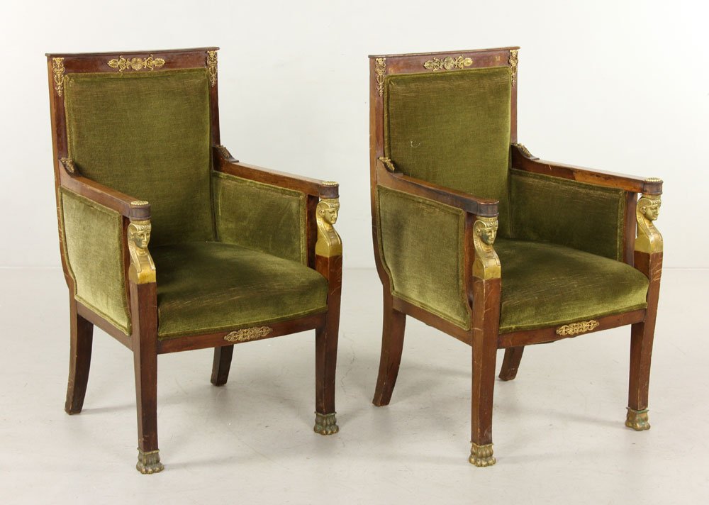 Pair Empire II Bergeres: Pair Of Empire II bronze mounted mahogany bergères, of reserved architectural form with tall backs and flat pediments, the arms resting on Egyptian style bronze terms and with lion claw feet, upholst