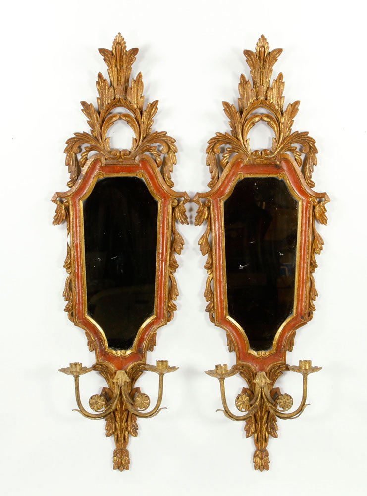 Pr. French Lumieres: Late 18th century, pair of French Directoire decoratively painted, carved, and gilded wood two light Bras de Lumière, the framed enclosing cartouche mirrors and carved with a symmetrical arrangement 