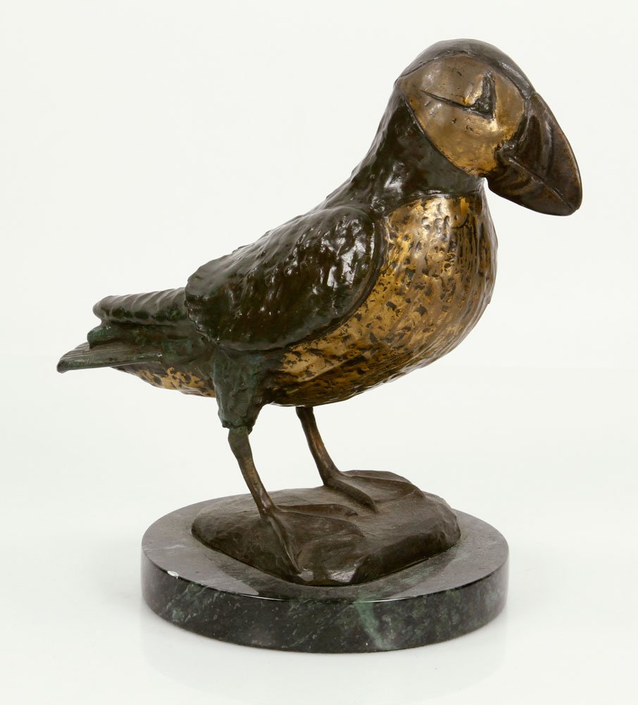 Statue of a Puffin, Bronze: Whimsically cast and patinated bronze statue of puffin, standing on a round verde marble plinth and with a doleful countenance. Provenance: From the unreserved estate of a prominent Los Angeles attorn