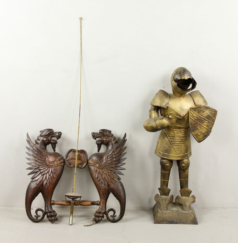 Lot of 2 Decorative Items: Lot of two decorative items, to include: small Gothic style gilt metal suit of armor, posed with shield and visor helmet, and Southern European carved oak armorial, detailed with affronted chimeras, m