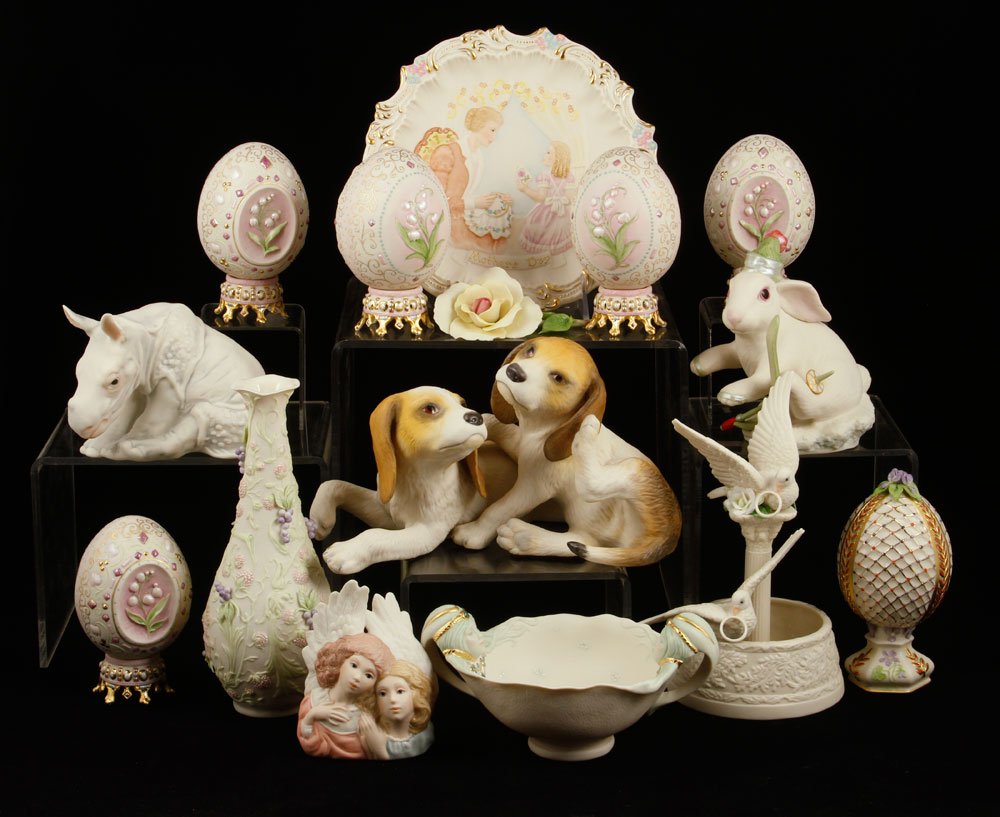 Lot of 15 Cybis Items, Porcelain: Lot of fifteen Cybis items, porcelain, to include: six eggs, one pair of puppies figure, one rhinoceros, one angel, one bowl, one ski bunny, one rose, one centerpiece with pair of doves, one plate and