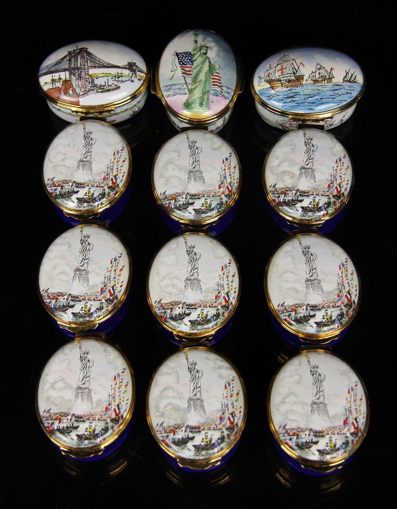 Lot of 12 Enameled Boxes: Lot of twelve boxes, enameled, to include: nine by Crummles & Co. and three by Halcyon Days, retailed by Tiffany and Co, all in original boxes, each measures approx 1" h x 1 3/4" l x 1 1/2" d. Provena