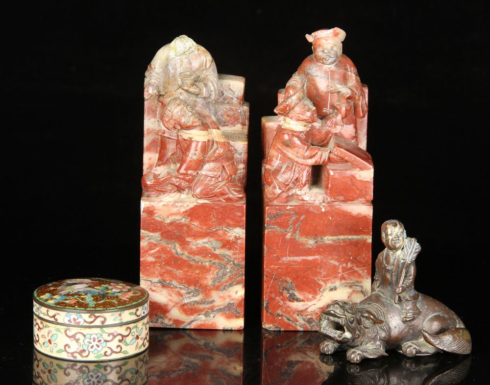 Lot of 4 Chinese Items: Lot of four Chinese items, to include: bronze figure, pair of red-hued soapstone bookends and cloisonné round box; single bookend measures 7" h x 2 3/8" w x 2 3/8" d. Provenance: From a California es