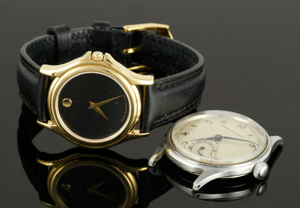 Lot of 2 Wristwatches: Lot of two wristwatches, to include: one Girard-Perregaux men's wristwatch, white-tone metal, white dial, white-tone numbers and hands, minute track at 6 o'clock; and one Movado ladies' wristwatch, go