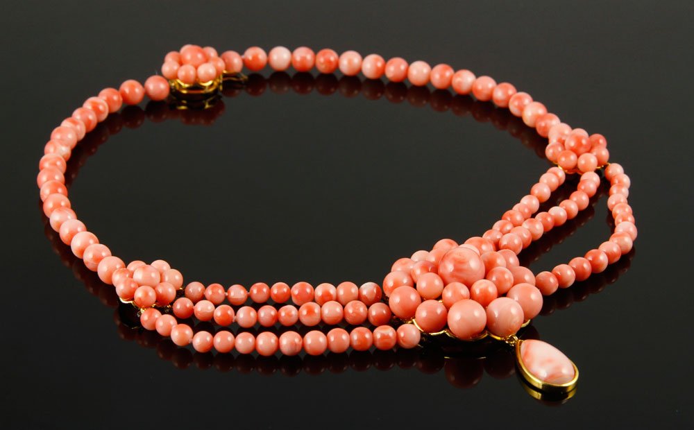 Sterling and Coral Necklace: Necklace, sterling silver and angel skin coral, design copied from the necklace worn by Scarlett O'Hara in "Gone With the Wind," 16" l. Provenance: From a New Hampshire Estate