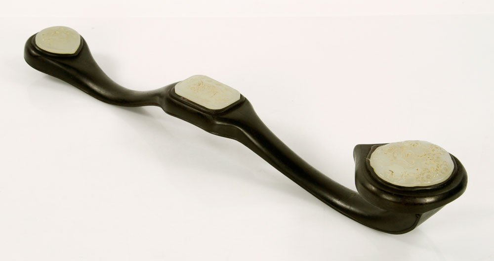 Chinese Wood and Jade Ruyi Scepter: Chinese Ruyi scepter, zitan wood, with three mounted jade inserts, 26" l. Provenance: from a Connecticut collection.