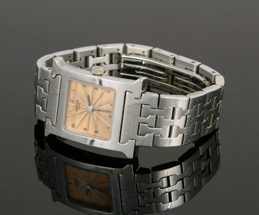 Hermes Heure H Watch, Rose Gold and Sterling Silver: Hermes "Heure H" watch, rose gold face and sterling silver case, quartz movement, serial no. 1562918, 5/8" dia (face). Provenance: From a Massachusetts estate.