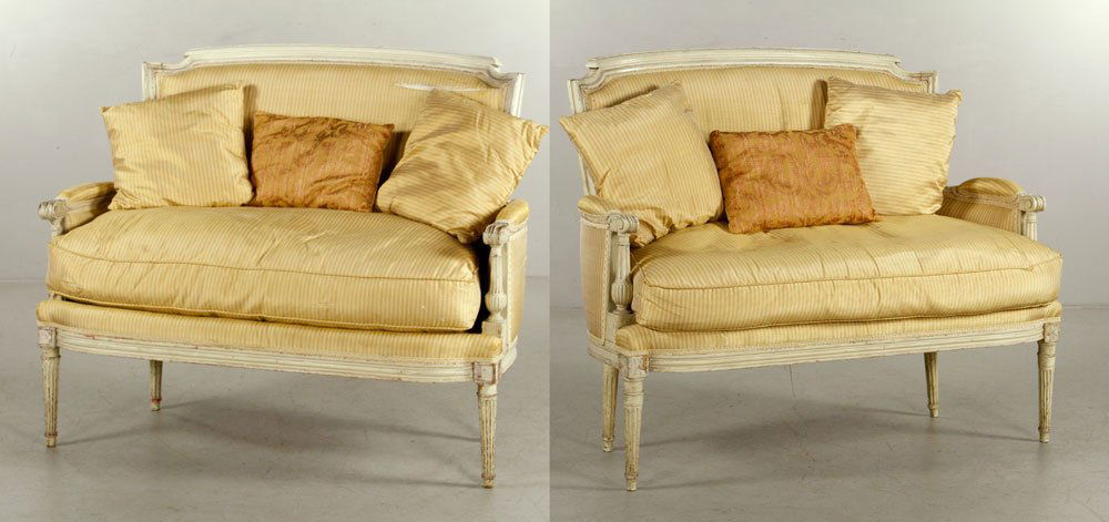 Pair of Louis XVI Painted Settees: Pair of early 19th century Louis XVI painted settees, with down-filled upholstery, 36" h x 44" w x 27" d. Provenance: from a Florida estate.