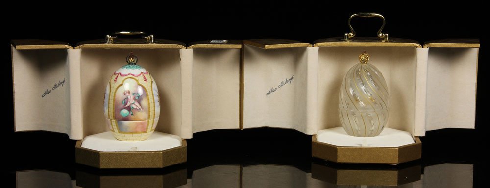 Theo Faberge, "Ornamental Eggs," Porcelain and Glass: Pair of Theo Faberge ornamental eggs, one porcelain, one glass, limited edition, in case, 7 1/2" (cased). Provenance: from a New Hampshire estate.