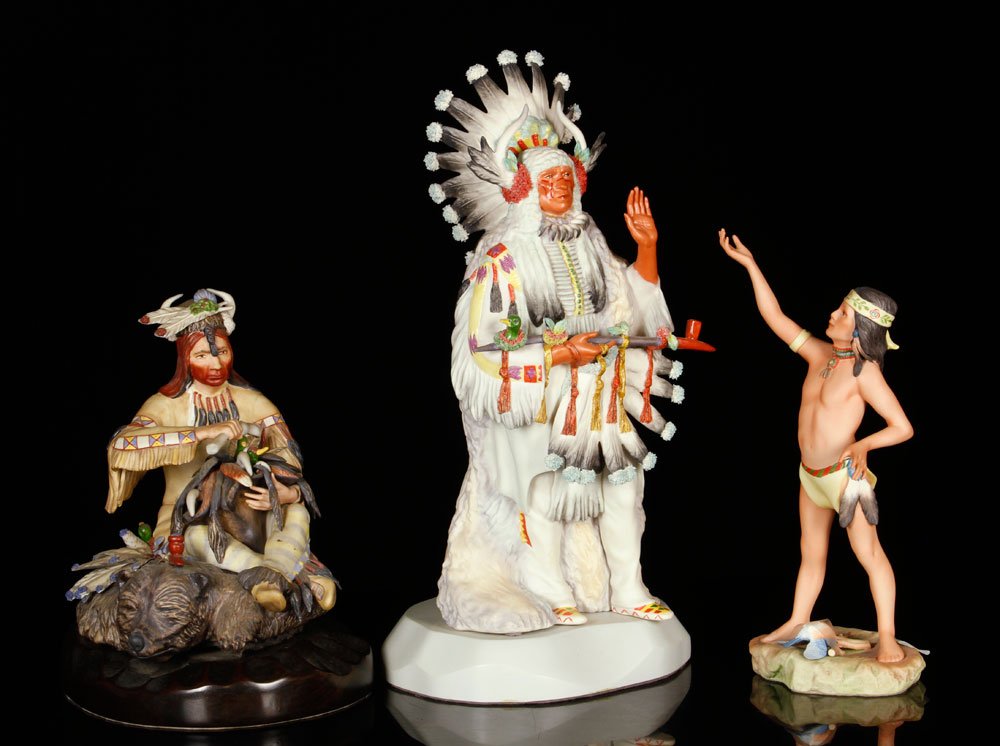 Lot of 3 Cybis Porcelain Native American Figures: Lot of three Cybis figures, porcelain, to include a chief, boy with bluebird and man seated on bearskin rug, 16" h (tallest). Provenance: from a New Hampshire estate.